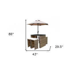 Six Piece Brown and Tan Faux Wicker Outdoor Bar Height Table Set with Umbrella and Stools